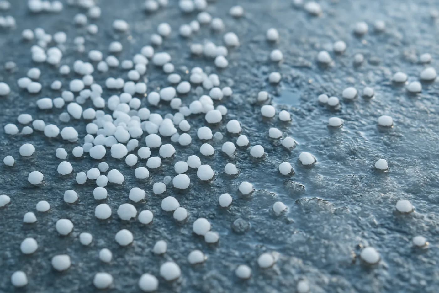 Ice melt spread on a winter surface, Canada